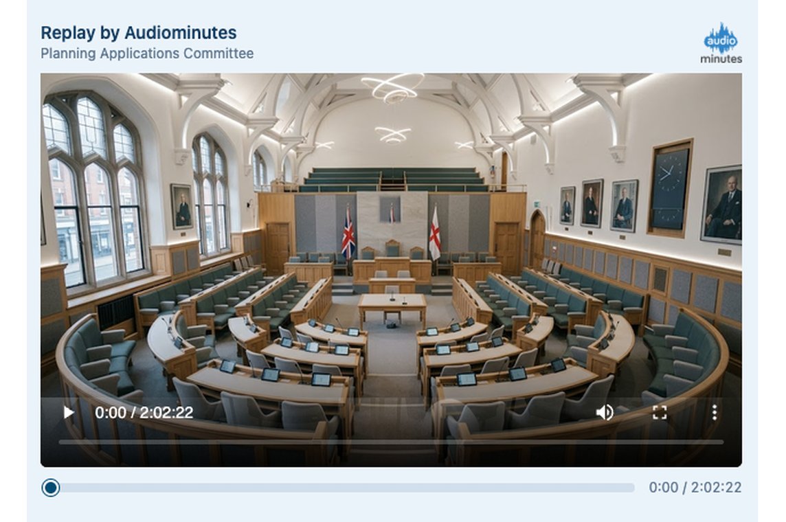 The public player replaying an archived committee meeting in video, with the chamber in view